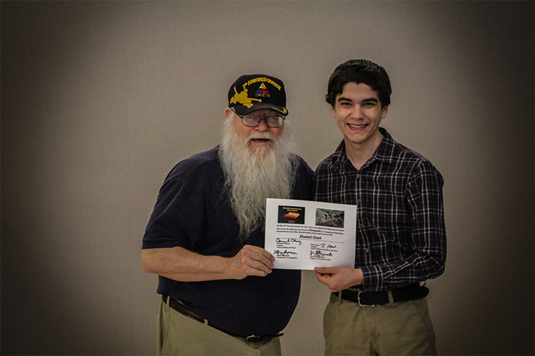 Jim Hollingsworth (left) promoting Daniel Guel (right) to Sergeant in the Texas Chess Militia.